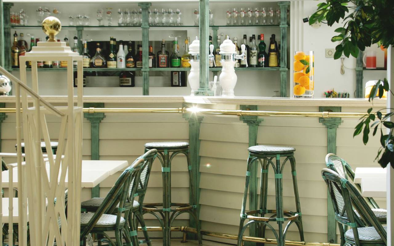 High chairs around the bar with cold drinks, restaurants in lourdes france, Hotel Saint-Sauveur.